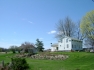 far away picture of house on large parcel of land