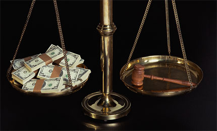 scale with gavel and cash